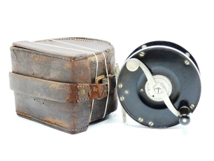 An early Edward Vom Hofe Restigouche 6/0 direct drive salmon fly reel, ebonite and nickel silver construction with counter-balanced serpentine scroll handle set within an anti-foul rim and mounted above an 1879 milled circular four point tension adjusting