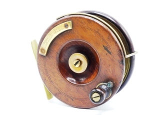 An unusual C. Farlow & Co. patent Sun 5" centre pin reel, brass backed walnut drum with bulbous wooden handle and brass counter-balance plate, script engraved retailers details and recessed brass milled spindle tension adjuster, Bickerdyke line guide, br