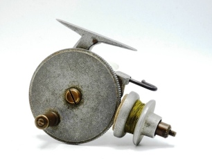 An Allcock Stanley pre-production threadline casting reel, alloy construction with brass handle on circular drive plate, friction drive spool and reciprocating steel line guide, milled brass drum tension nut, see Stephenson J.: Understanding Threadlines 