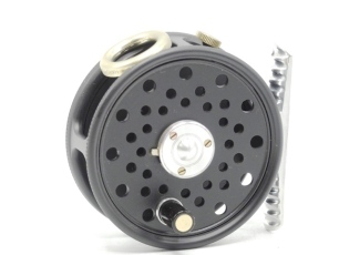 A Hardy St. George Junior trout fly reel, left hand wind re-issue model with ebonite handle, ribbed alloy foot, three screw spring drum latch, white metal line guide, milled rim tension screw and Mk.II check mechanism, new/unused condition, in block leath