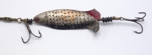 An early 2 ½" Propellor Minnow bait, the fish shaped nickel silvered lure with split tail, incised scale decoration and revolving central spindle with head and rear mounted treble hooks, similar to the Allcock Clipper example in the 1871 catalogue, circa 