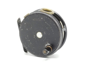 A rare Hardy Perfect 3 1/8" "wartime" black finish trout fly reel and card box, ebonite handle, ribbed brass foot, nickel silver line guide, milled rim tension screw and Mk.I check mechanism, interior stamped "J.S." (Jimmy Smith), only light wear to blac