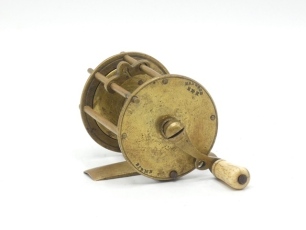 A scarce Haywood brass wide drummed winch, turned bone handle on curved crank winding arm, dome locking screw, brass block foot, sliding drum locking pin, faceplate stamped makers details, 1 ?" x 1 ?", circa 1850 (see illustration)