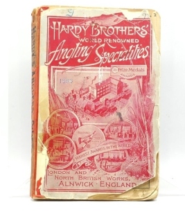 A scarce Hardy Angler's Guide "G" 1897 edition, red pict soft covers, b/w text illust, red clo. spine, front cover torn at extremities