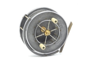 An Allcock Aerial Popular 4" centre pin reel, caged and six spoked drum with twin xylonite handles, solid flanges (no perforations) and twin release/regulator forks, B.P. line guide, brass stancheon foot, rear sliding optional check button and bar spring 