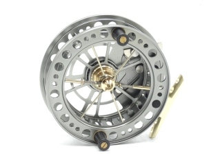 A J.W. Young Bob James Lightweight Y2080L 4 ½" centre pin reel, graphite anodised finish, multi-perforated six spoked drum with twin composition handles and release/regulator forks, stancheon foot, rim mounted optional check lever and bar spring check mec