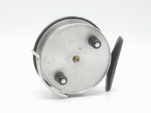 A Hardy Triumph 3 ¼" centre pin reel, shallow cored solid alloy drum with twin ebonite handles and domed brass locking screw, Bickerdyke line guide, rear sliding brass optional check button and calliper spring check mechanism, reel retains much of the ori