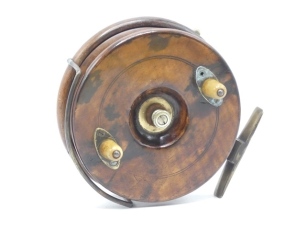 A scarce Hardy New Nottingham 1912 6" centre pin reel, walnut drum with twin horn handles on elliptical brass plates and recessed spindle well with milled nickel silver tension nut, Bickerdyke line guide, rim mounted optional check lever, brass starback 