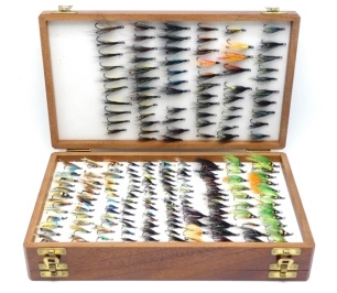 A Farlow double sided teak fly box, holding a selection of 565 hair wing double salmon flies and a Wheatley take fly box also holding a similar selection of 183 hair wing double salmon flies (2)