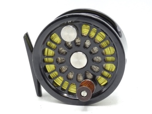 An Abel No.2 saltwater/light salmon fly reel, black anodised finish, counter-balanced handle, block foot, rear spindle mounted milled tension adjuster, light use only, in original pouch