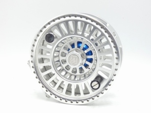 A fine Hardy Zane No.4 Extreme 5 ¼" saltwater fly reel, silver anodised finish left hand wind model with skeletal large arbour drum, knurled spindle locking nut, counter-balanced handle, and rear graduated spindle mounted drag adjuster, ventilated backpla