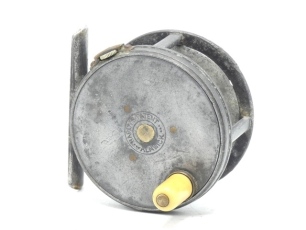 A scarce Hardy Perfect 2 ½" wide drummed trout fly reel, ivorine handle, alloy foot, strapped rim tension screw with 1906 calliper spring check mechanism, slightly dished drum with four rim cusps and milled nickel silver locking screw, faceplate stamped c