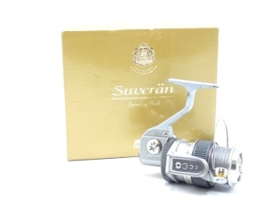 An Abu Suveran S300M fixed spool reel, grey anodised finish, folding handle, drum mounted drag adjusting ring, anti-reverse rear spool mounted ring, full bail arm, in original card box with spare spool and instruction manual, light use only (see illustrat