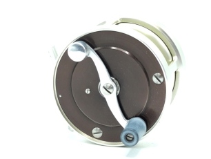 A good S.E. Bogdan 150 multiplying light salmon fly reel, black/champagne anodised finish right hand wind model, 2:1 ratio gearing, counter-balanced "S" scroll handle set within an anti-foul rim, block foot, stamped model detail, rear milled optional ch