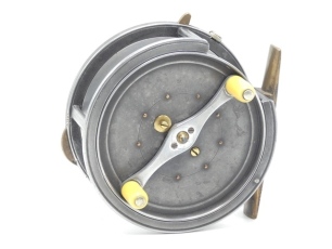 A Hardy Silex 4 ¼" bait casting reel, caged drum with twin ivorine handles on alloy crossbar arm, jewelled spindle bearing and spring release latch, brass bridge foot, cut-away rim section, three various rim mounted casting controls, interior stamped "D"