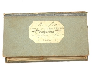 A very rare Henry Bew fly compendium of rectangular book form, front green card cover board with applied chamfered rectangular paper trade label printed "H. Bew, Needle, Fishing Rod & Tackle Manufacturer, No.19 Newgate Street, London", interior fitted two