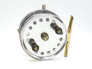 A good Hardy Longstone 4 ½" duralumin sea centre pin reel, drum with single band of perforations, twin reverse tapered ebonite handles and milled brass spindle tension nut with milled nickel silver locking screw, Bickerdyke line guide, brass foot, rim mou