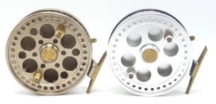 An Arnold Kingpin Regal 4 ½" centre pin reel, gold anodised finish, multi-ventilated shallow cored drum with twin composition handles, stancheon foot, rim mounted optional check lever, rear milled spindle locking ring, new/unused condition, in neoprene p