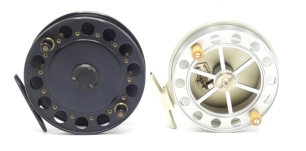 A Greys Beswick 4 ¼" centre pin reel, shallow cored drum with twin ivorine handles and two screw spring release latch, stancheon foot and rear optional check button, as new condition and a Swallow 4 ½" centre pin reel, caged drum, twin handles, rear opti