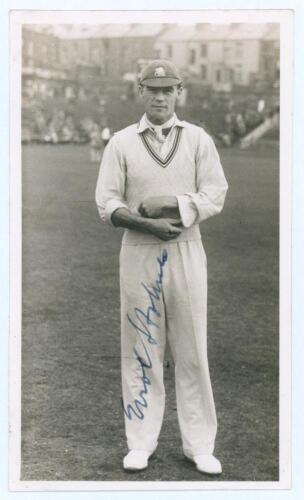 Errol Reginald Thorold Holmes. Surrey, Oxford University & England 1924-1955. Original sepia real photograph postcard of Holmes standing full length wearing cricket attire and cap on the outfield at Scarborough. Very nicely signed in blue ink to the photo