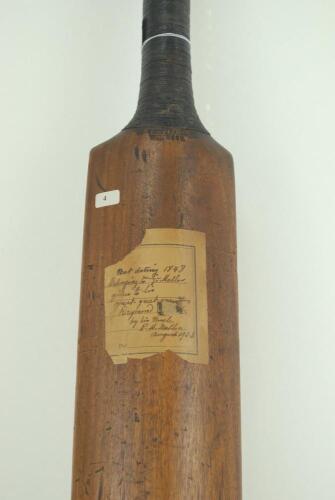 A late one-piece cricket bat. A mid 19th Century one-piece cricket bat made by John Thompson of Windsor and dated 1848. The bat is unspliced, narrow and straight shouldered with an unusually slightly convex face and the back of the blade is humped. The ba