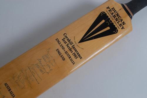 England v Australia 1985. Duncan Fearnley cricket bat signed to the face by twelve of the England and fifteen members of the Australian teams. Signatures include Gower, Botham, Gatting, Lamb, Gooch, Downton, Willey, Robinson, Border, Lawson, O&rsquo;Donnell, Th