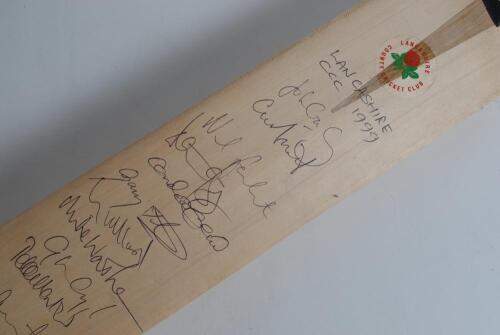 Lancashire C.C.C. 1999. Full size cricket bat signed to face by twenty members of the Lancashire playing staff. Signatures include Crawley, Atherton, Fairbrother, Watkinson, Muralitharan, Hegg, Martin, Schofield, Yates, Ridgway, Flintoff etc. Good conditi