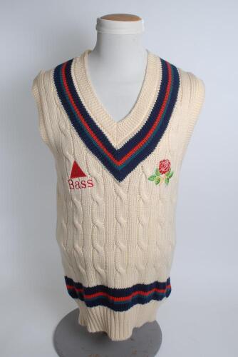 Lancashire white 1st XI sleeveless sweater, by Luke Ayres, with trimming to collar and waist in club colours, Lancashire emblem and sponsors logo ‘Bass’ to chest. Size 40”. Player unknown. Good condition