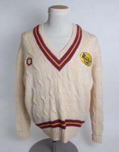 Northamptonshire white 1st XI long sleeved sweater, by Merlin, with trimming to collar and waist in club colours, Northamptonshire emblem and sponsors logo ‘Dr Martens’ to chest. Size 48”. Player unknown. Good condition