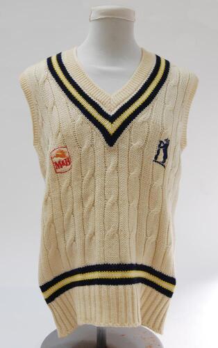 Norman Gifford. Worcestershire, Warwickshire & England 1960-83. Warwickshire white 1st XI sleeveless sweater with trimming to collar and waist in club colours, Warwickshire emblem and sponsors logo ‘M&B’ to chest. Size 44”. Gifford’s initials ‘N.G.’ to n