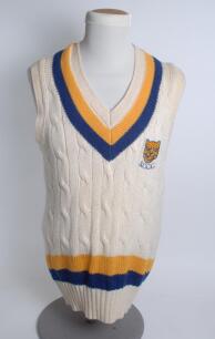 Shropshire white 1st XI sleeveless sweater, by ‘Brian Shantry Knitwear’, with trimming to collar and waist in club colours, Shropshire emblem to chest. Size 42”. Player unknown. Good condition