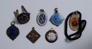 Sydney Cricket Ground membership medals. Five early gilt metal medals for Sydney Cricket Ground for 1903/04, 1905/06, 1906/07, 1919/20 and 1929/30. Three with colour enamel decoration. Some wear, tarnishing and staining to two of the medals. Sold with a m