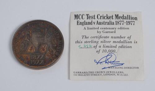 M.C.C. Test Cricket medallion. England v Australia 1877-1977. Sterling silver gilt medallion commemorating the Centenary of England v Australia Test cricket by Garrard & Co. The face with the Ashes urn to centre with lion and kangaroo to each side with d