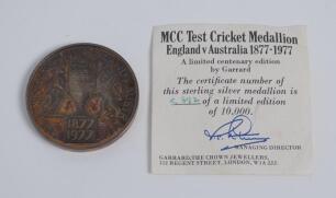 M.C.C. Test Cricket medallion. England v Australia 1877-1977. Sterling silver gilt medallion commemorating the Centenary of England v Australia Test cricket by Garrard & Co. The face with the Ashes urn to centre with lion and kangaroo to each side with d