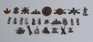 Cricket buckles. A small collection of assorted metal and brass cricket motifs, used to decorate and enhance belt buckles. Motifs include boys batting, batsman, bowlers, groups of cricketers with stumps, bat, pad and ball group, crossed bats, balls, glove