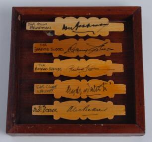 ‘Cricketing Knights (Knighthoods awarded for Services to Cricket’. Five cricket bails, halved and nicely signed in ink by five cricketing knights. Signatures are Don Bradman, Garry Sobers, Richard Hadlee, Alec Bedser and Clyde Walcott. The bails varnished