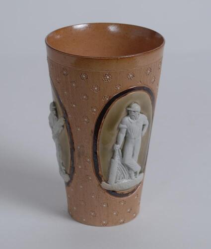 Doulton Lambeth stoneware beaker, moulded in relief with figures in roundels of a batsman (W.G. Grace) in different poses and impressed floral motif on a brown background. Doulton Lambeth impressed marks to base, date 1880, and makers marks to base of Emi