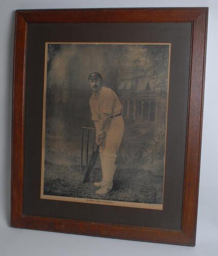 George Herbert Hirst. Yorkshire & England 1891-1929. Large and impressive mono studio photographic portrait of Hirst, full length, in batting pose wearing Yorkshire cap. Printed by H. Lindley & Co, Nottingham. Mounted, framed and glazed, overall 23”x29”. 