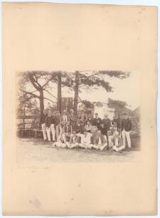 Moors v Rifle Brigade 1884. Excellent original sepia photograph of the two teams taken as a group with scoreboard and scoring tent to background. The two teams are dressed in an assortment of coloured blazers and caps and three dogs appear in the photogra