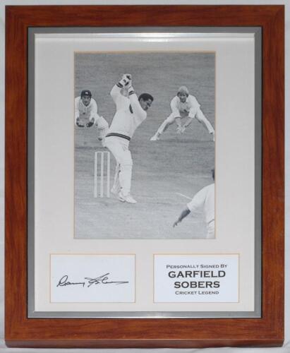 ‘Garfield Sobers. Cricket Legend’. Large mono photograph image of Garry Sobers in batting action for West Indies, window mounted with his signature on white card below. Framed and glazed overall 15.5”x19.5”. Good condition.