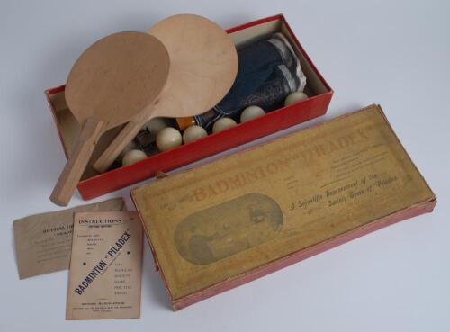 ‘The New Game of Badminton ‘Piladex’. Circa 1900- a cross between table tennis and badminton. A Victorian parlour game in original box with advertising label to box lid. The game appears complete with net, two bats, six balls and the instruction sheet. So