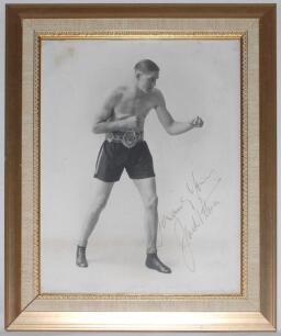 Jack Petersen. British and Empire (Commonwealth) Heavyweight Champion 1930s. Large original mono studio photograph of Peterson in boxing pose wearing his Lonsdale Belt. Nicely and boldly signed in gold ink by Peterson. Photographer’s signature in pencil t