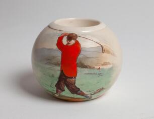 Golf ball match holder. Early heavy match holder with colour image of a golfer driving to side. Macintyre Co (Burslem). Stamp to base with number B3298. 2.75” tall, 3.25” diameter. G