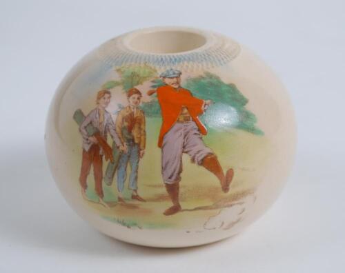 Carltonware, Stoke stoneware circular match holder printed with crossed golf clubs and balls and the golfers motto ‘Far and Sure’ in printed scroll. To verso a colour scene of a golfer with two caddie’s. The match holder stands 2.25” high, 3” diameter. Go