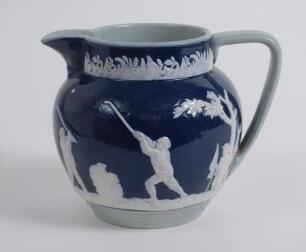 Golf jug. An attractive Copeland Late Spode jug, the body decorated with a continuous scene of golfers and caddies in white raised relief displaying various golfing swings and poses on a cobalt blue and grey ground with floral decoration. Circa 1910. 4.75