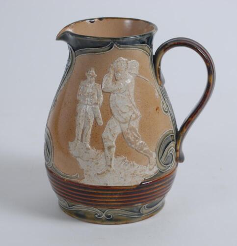 Royal Doulton Lambeth Golf jug. An attractive Royal Doulton Lambeth stoneware jug with strap handle, of bulbous form, with art nouveau design with scrolled foliate borders, enriched in green, blue and brown glazes, with three golfing scenes in white relie