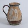 Royal Doulton Lambeth Golf jug. An attractive Royal Doulton Lambeth stoneware jug with strap handle, of bulbous form, with art nouveau design with scrolled foliate borders, enriched in green, blue and brown glazes, with three golfing scenes in white relie - 2