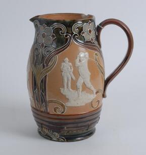 Royal Doulton Lambeth Golf Pitcher jug. A large and impressive Royal Doulton Lambeth stoneware jug, of bulbous form, with art nouveau design with scrolled foliate borders, enriched in green, blue and brown glazes, with three golfing scenes in white relief