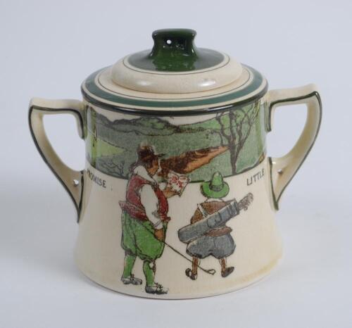 Royal Doulton &lsquo;Golfing series&rsquo; two handled sugar basin with lid, the body decorated with a continuous scene of cavalier figures (Crombie) of golfers and caddie playing golf with proverb inscription &lsquo;Promise little and do much&rsquo;, decorated with green line d