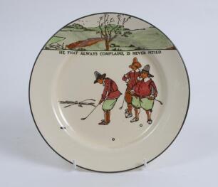 Royal Doulton ‘Golfing series’ plate, decorated to face in colour with cavalier figures (Charles Crombie) playing golf with proverb inscription ‘He that always complains is never pitied’,. Colour golf course border to top border of plate. 8.5” diameter. W